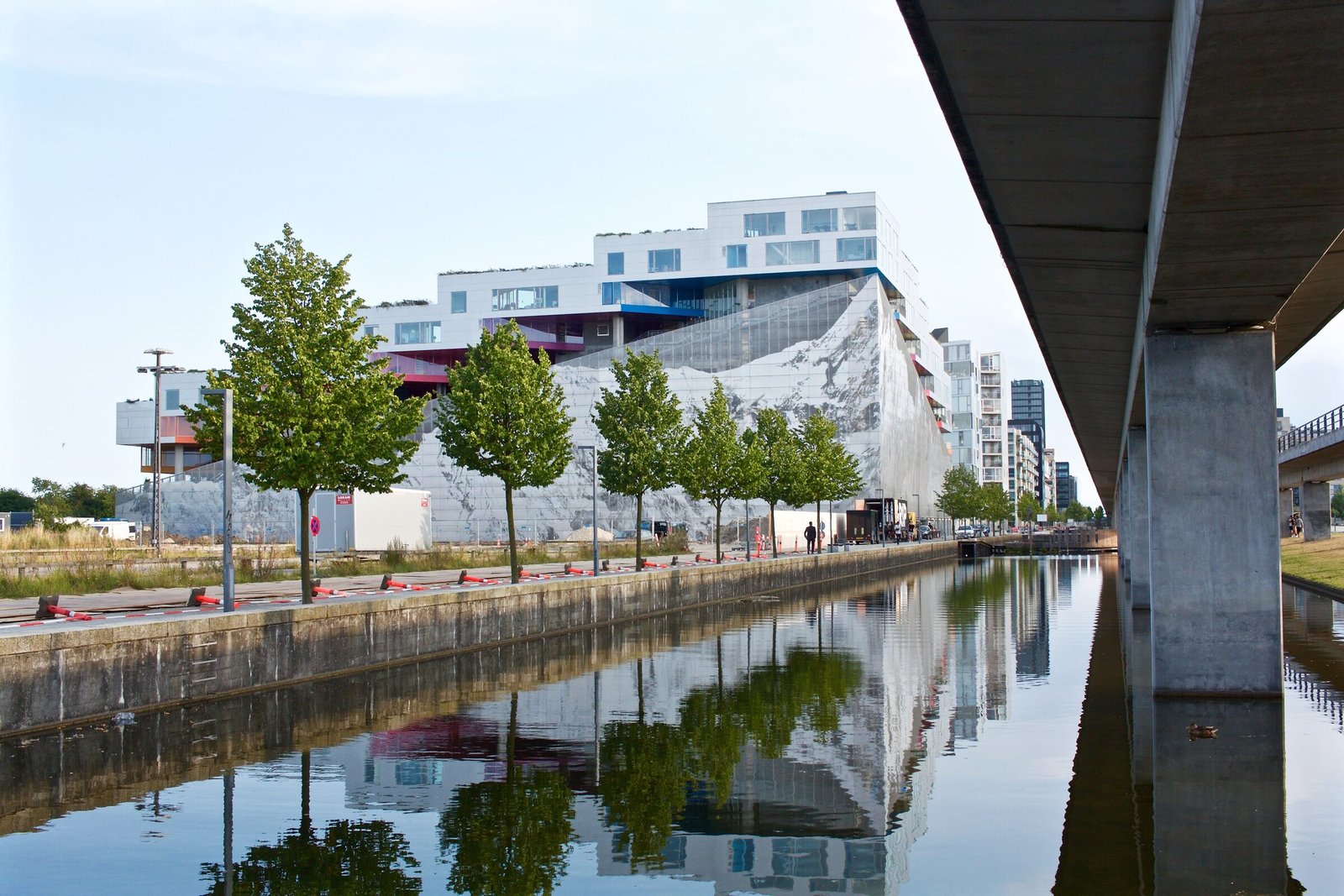 Canalside housing reflected in still water